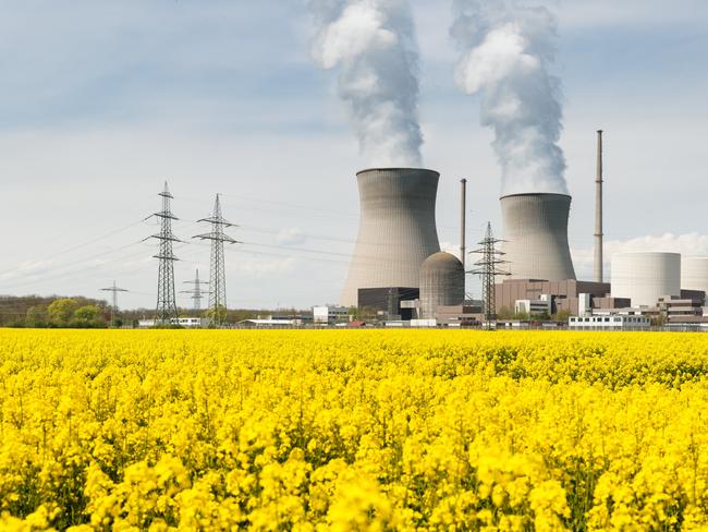 Nuclear power plant with yellow field and big blue clouds in Germany