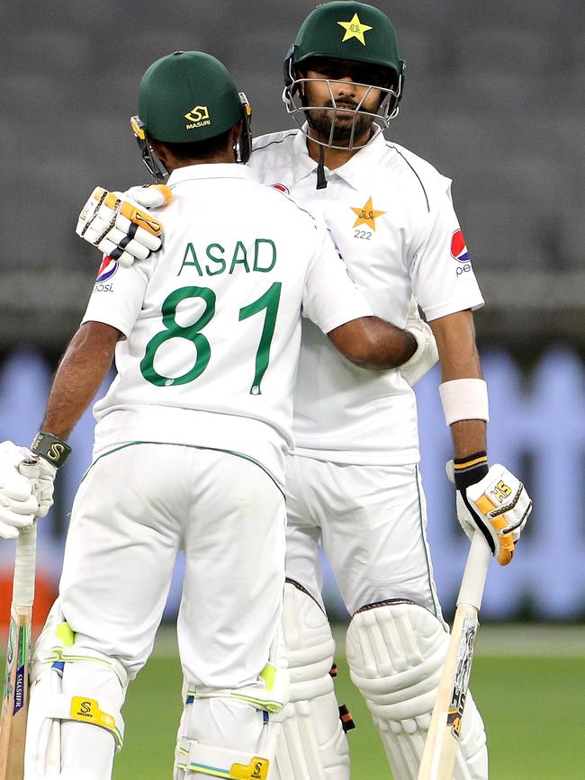 Asad Shafiq is congratulated by Azam on reaching his ton.