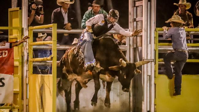 Real estate agent Jesse James rides a bull. Picture: Contributed