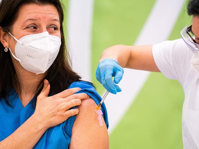 Medical personnel is given the Pfizer-Biontech COVID-19 vaccine at the Favoriten Clinic in Vienna, Austria. Picture: AFP / Austria OUT