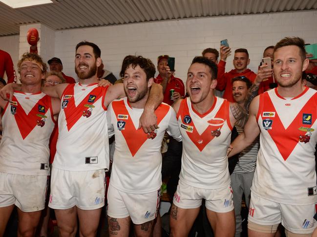 Karingal players celebrate their win over Langwarrin in the MPNFL Division 2 preliminary final. Picture: Chris Eastman