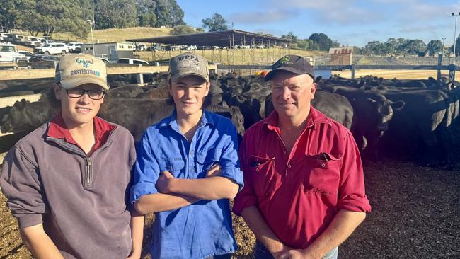 Axl, Syd and their dad Paul O'Brien of Sunnyside with their top pen of 48 Angus weaners weighing 383kg, Boonaroo and Pathfinder bloodlines. They were the largest vendors at the Casterton sale on Tuesday. Picture: Kate Dowler