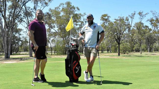 CHIPPING IN: Former National Rugby League players Michael Crocker and Chris Walker had a quick putt at the Roma Golf Club, lending their support to the Men of League charity tournament on the weekend. Picture: Jorja McDonnell