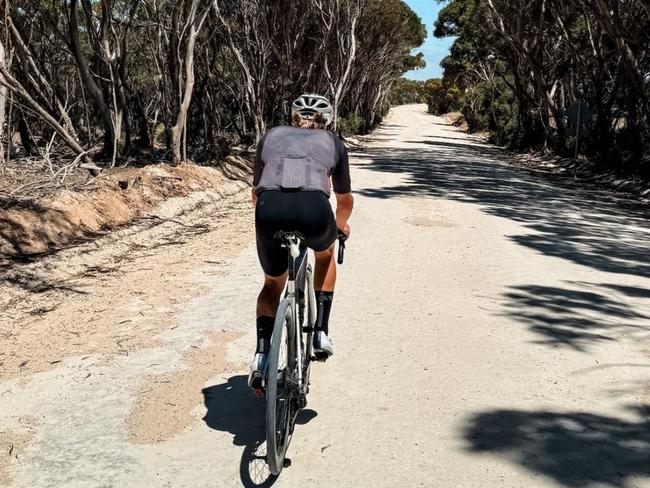 Caption: F1 driver Valtteri Bottas cycling on Kangaroo Island.