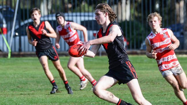 Rostrevor’s Max Michalanney kicks forward. Picture: Brenton Edwards