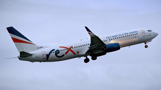 A Rex 737 in the skies over Melbourne. Picture: William West/AFP