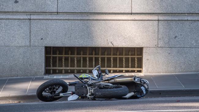 The damaged police bike on the scene. Picture: Jason Edwards