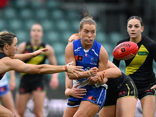 Mia King gets a handball away under pressure against Richmond. (Photo by Steve Bell/AFL Photos/via Getty Images)