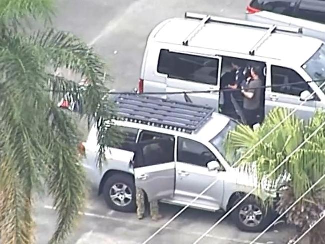 Police at the scene of a lockdown at Pimpama on the Gold Coast. Picture: Nine News.