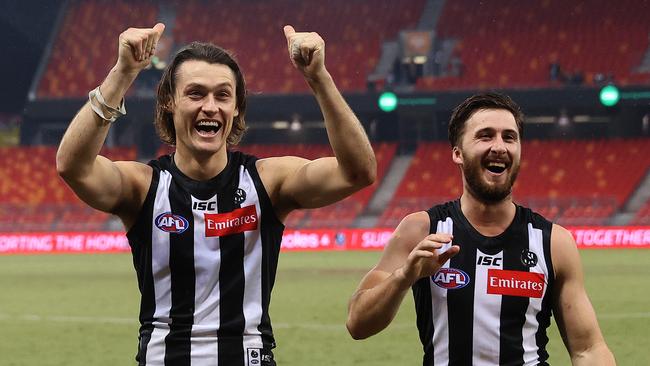 Darcy Moore and Tom Phillips celebrate the victory.