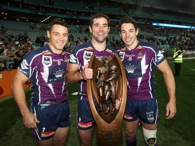 Cooper Cronk, Cameron Smith and Billy Slater with the trophy after the 2012 grand final.