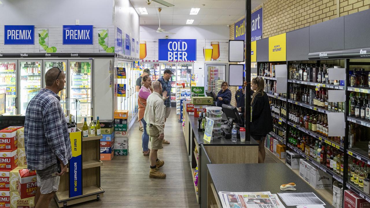 Customers flood Al's Bottlemart immediately after opening. Picture: Jon Gellweiler/news.com.au