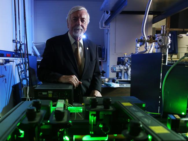 20/02/2020. German physicist Heinrich Hora pictured with high power laser technology in the photonics and opto-electronics research lab, School of Physics at UNSW in Sydney. His research is core to UNSW Sydney spin-out company, HB11 Energy, which has been granted patents for its laser-driven technique for creating clean fusion energy. Britta Campion / The Australian