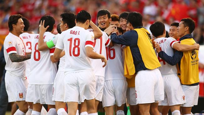 CANBERRA, AUSTRALIA - JANUARY 18: Sun Ke of China celebrates with team mates after scoring a goal during the 2015 Asian Cup match between China PR and DPR Korea at Canberra Stadium on January 18, 2015 in Canberra, Australia. (Photo by Mark Nolan/Getty Images)