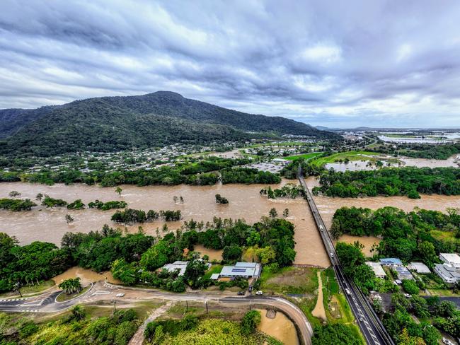 The Barron River in Cairns, Far North Queensland, has reached a record flood peak, with roads closed and homes flooded in the catchment area. Flood waters lap at the Kamerunga bridge on the Western Road, and despite the bridge remaining open, road access is still cut to the northern beaches of Cairns. The record flooding has been caused by ex Tropical Cyclone Jasper, which made landfall on December 13. Picture: Brendan Radke