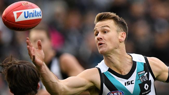 Robbie Gray gathers the ball during his mighty effort against Collingwood at the MCG. Picture: Julian Smith (AAP)