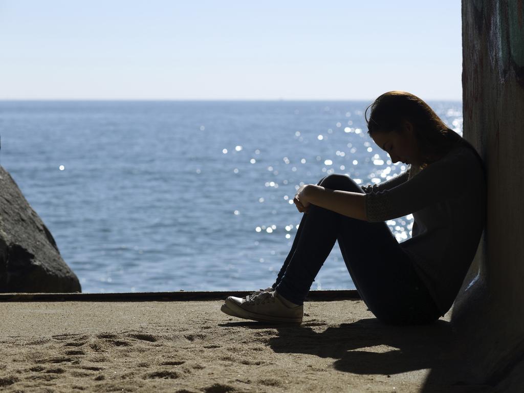 Teen girl lonely and sadness on the beach Mental health generic thinkstock Girl depressed on the beach female sad depressed lonely suicidal teenager Depression generic Mental illness Sexual abuse generic