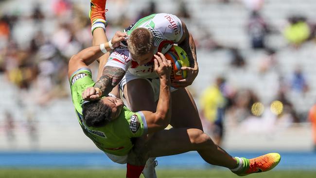 Aaron Gray is up-ended by Nick Cotric during the 2017 Auckland Nines match between Canberra and South Sydney at Eden Park. Picture: Getty Images