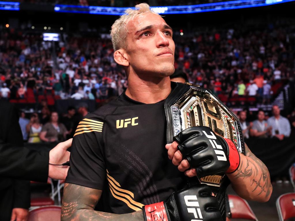 Charles Oliveira celebrates defeating Michael Chandler.
