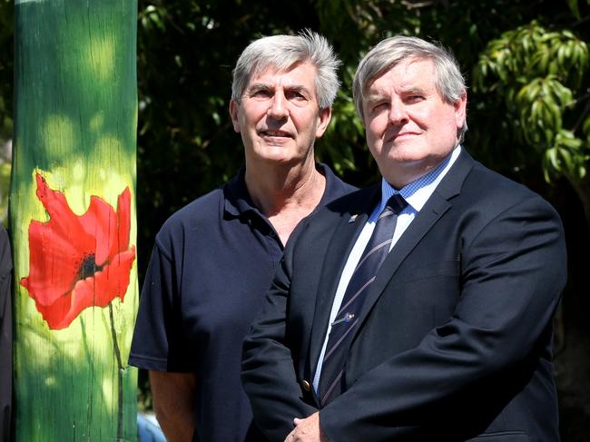 30 light poles along Anzac Ave have been decorated with painted with poppys for this year's Anzac Day celebrations. Howard Buckley, Jeff Smith, Maurie Graham and Cr Laurie Smith. Photograph; Renae Droop