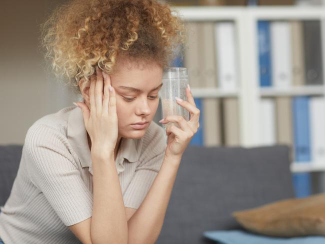 Headache is one of the more common adverse effects of receiving a Pfizer or AstraZeneca inoculation, the TGA reports. Picture: iStock