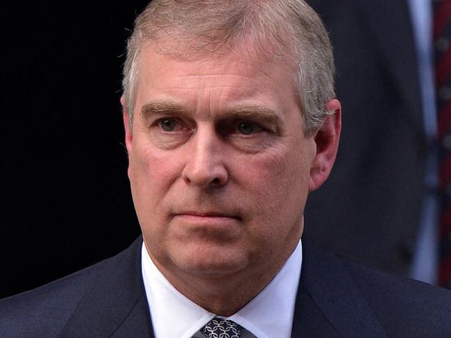 (FILE PIC)  Britain's Prince Andrew, Duke of York, leaves the hospital where his father Prince Philip, Duke of Edinburgh, is being treated for a bladder infection in London on June 6, 2012. Queen Elizabeth II and Prince Andrew, Duke of York, visited Prince Philip on June 6 at the London hospital where he was taken two days ago with a bladder infection, forcing him to miss the Queen's final diamond jubilee celebrations.   AFP PHOTO / CARL COURT (Photo by CARL COURT / AFP)