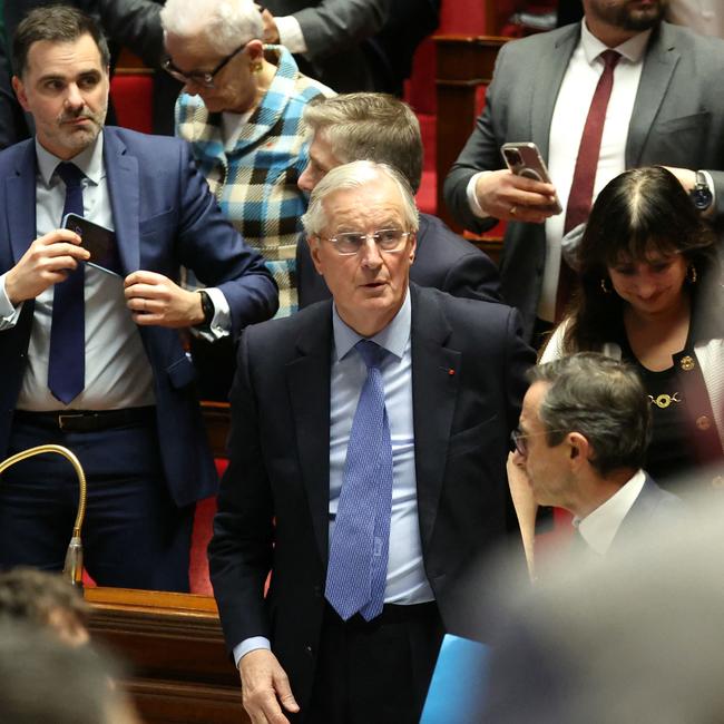 French Prime Minister Michel Barnier reacts after the result of the no-confidence vote on his administration at the National Assembly in Paris.