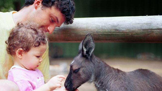 Bethany Buhagiar and her dad on Australia Day, 2004. Picture: Ann Moran