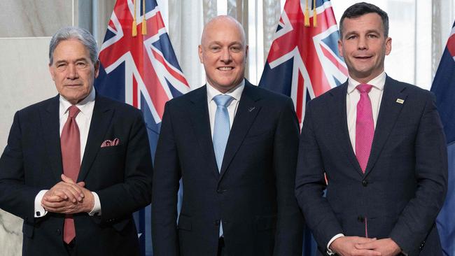 Winston Peters, Christopher Luxon and David Seymour after signing the agreement to form a three-party coalition government. Picture: AFP.