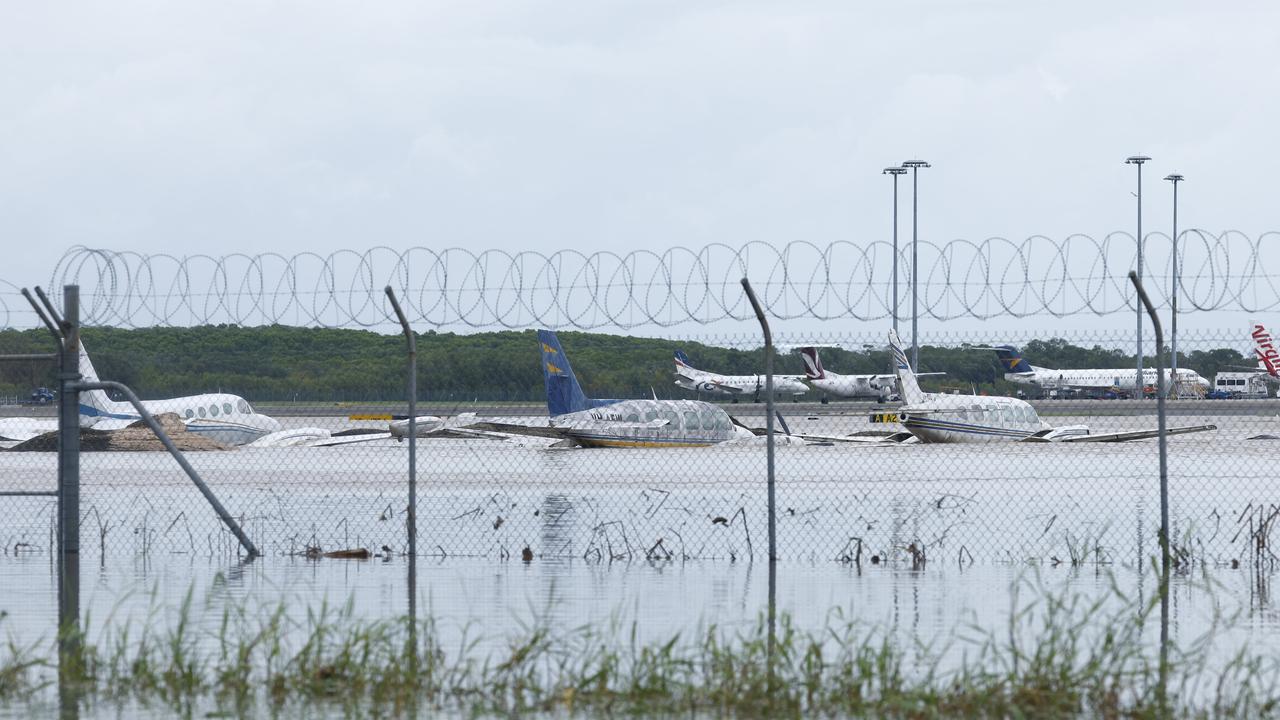 Cairns Airport closed flights as flood water from Tropical Cyclone Jasper caused severe flooding at the approach and departure zones as well as the taxi strip on the runway on Sunday, December 17. Picture: Brendan Radke