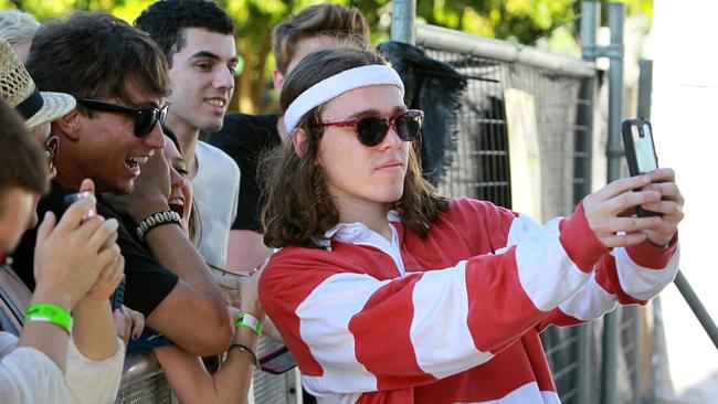 Hills artist Allday poses for a selfie with fans at the Sunny Dayz music festival.