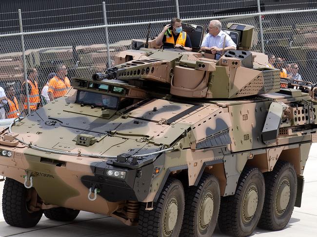 Scott Morrison rides in a new Australian Boxer CRV at the official opening of Queensland’s Rheinmetall Military Vehicle Centre of Excellence on the weekend. Picture: NCA NewsWire / Sarah Marshall