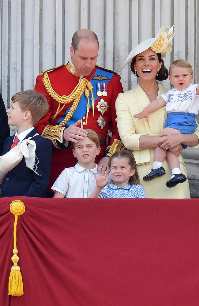 Britain's Prince William, Duke of Cambridge, Prince George, Princess Charlotte and Britain's Catherine, Duchess of Cambridge holding Prince Louis stand with other members of the Royal Family. Picture: AFP