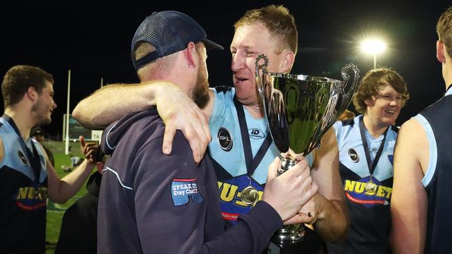 Lindisfarne coach Daniel Willing (left) celebrates with captain Michael Cassidy after winning last year’s SFL grand final. Picture: NIKKI DAVIS-JONES