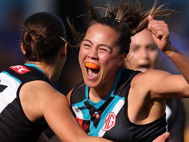 PERTH, AUSTRALIA - OCTOBER 05: Justine Mules-Robinson of the Power celebrates a goal during the round six AFLW match between West Coast Eagles and Port Adelaide Power at Mineral Resources Park, on October 05, 2024, in Perth, Australia. (Photo by Paul Kane/Getty Images)