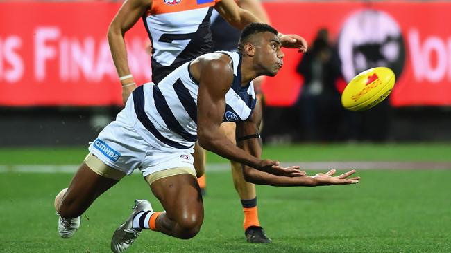 Geelong’s Esava Ratugolea marks against the Giants at GMHBA Stadium last night. Picture: Getty Images