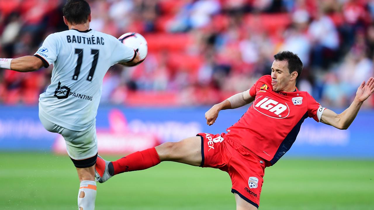 Adelaide’s Isaias competes with Brisbane Roar’s Eric Bautheac in the round six A-League match at Coopers Stadium in Adelaide. Picture: Mark Brake/Getty Images