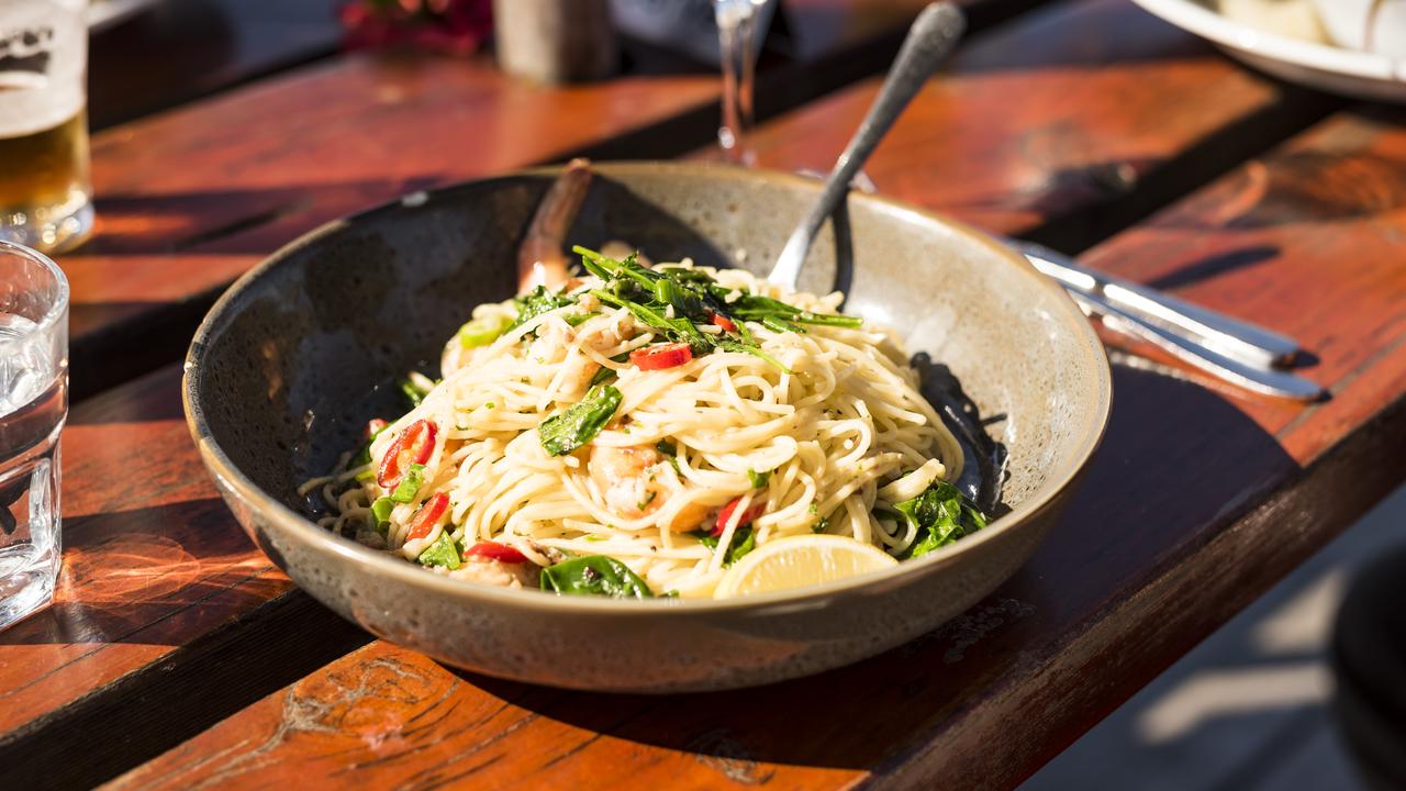 Settle in for a delicious meal by the water at the Metung Hotel. Picture: Destination Gippsland