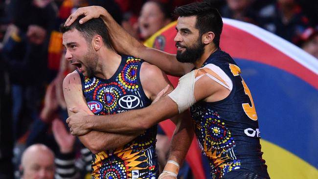 Rory Atkins and Wayne Milera celebrate a goal against West Coast. Picture: AAP Image/David Mariuz