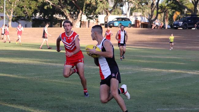 BITS Saints player Kaiden Jenkins makes a fast break against the Yeppoon Swans.