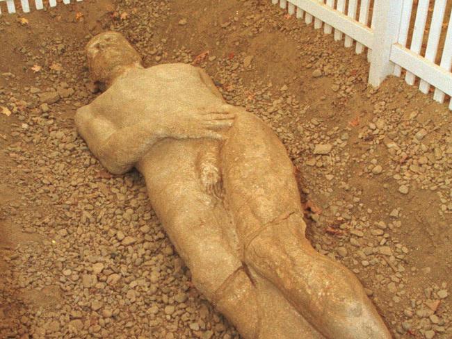 OCTOBER 1999 : Nicole Retzler, curator of exhibitions at the Farmers Museum in Cooperstown, New York, looks over the Cardiff Giant exhibit 10/99.USA