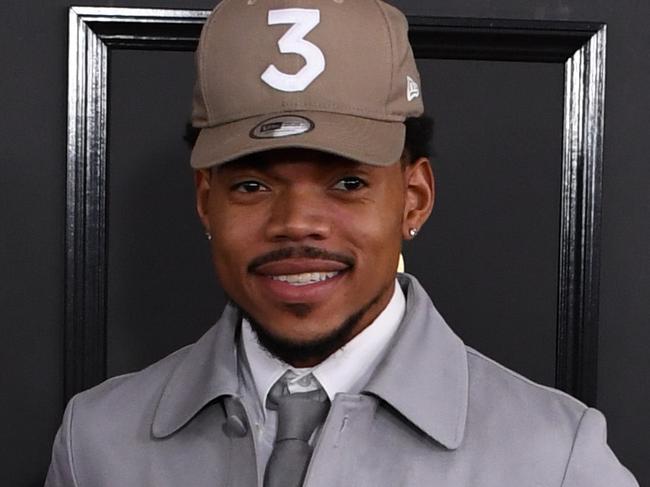 (FILES) This file photo taken on February 12, 2017 shows Chance the Rapper arriving for the 59th Grammy Awards in Los Angeles, California. Fast-rising star Chance the Rapper on March 6, 2017 donated $1 million to Chicago's schools as he waded into the middle of a political feud that threatens to close down classrooms weeks early. / AFP PHOTO / Mark RALSTON