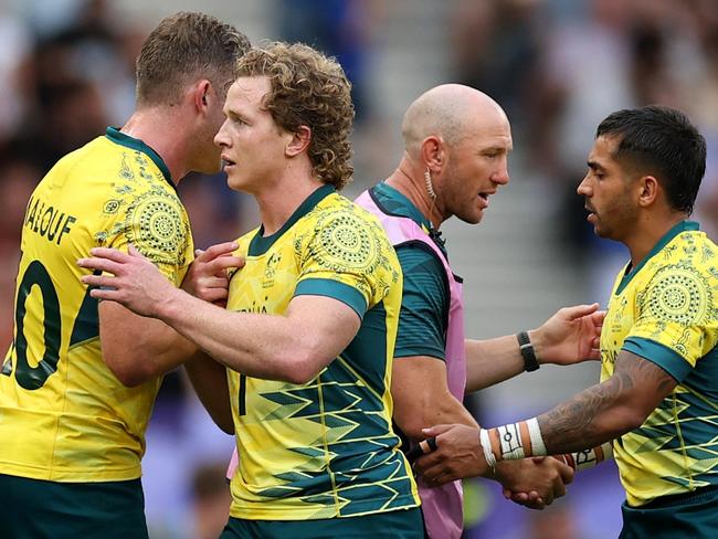 PARIS, FRANCE - JULY 24: Nick Malouf #10 of Team Australia and Henry Hutchison #1 of Team Australia celebrate following victory during the Men's Rugby Sevens Pool B Group match between Australia and Kenya on Day -2 of the Olympic Games Paris 2024 at Stade de France on July 24, 2024 in Paris, France. (Photo by Cameron Spencer/Getty Images)