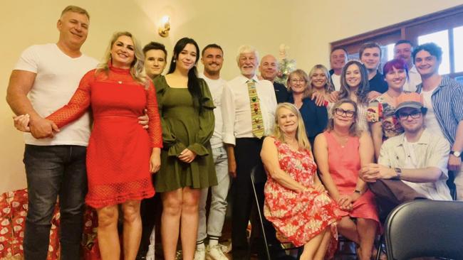 Ms Butterick, second from left, with family and friends including William Holdback, front right, at Christmas in 2022. Picture: Facebook.