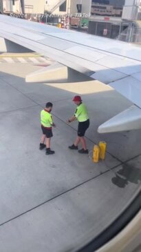 Heartwarming moment between two airport workers