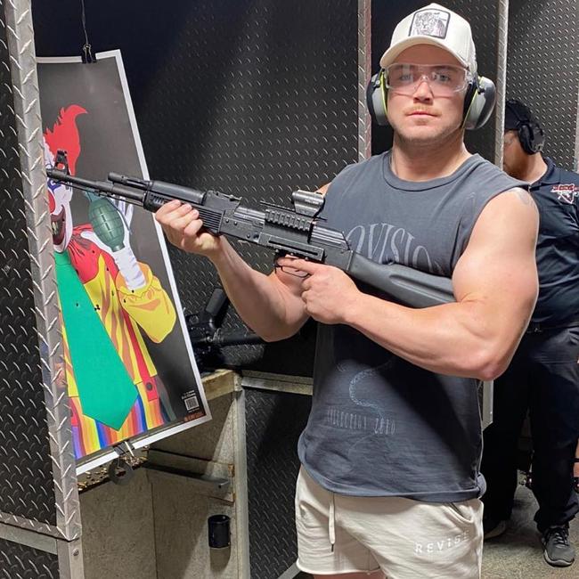 Canberra Raiders forward Hudson Young poses with an AK-47 at a gun shop in Las Vegas. Picture: Instagram