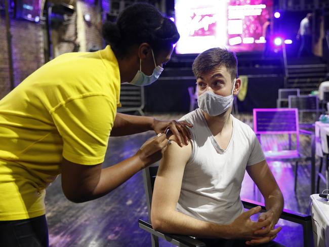 A young man receives a dose of the Pfizer vaccine at an NHS Covid-19 vaccination centre hosted at the nightclub Heaven in London. Picture: Getty Images