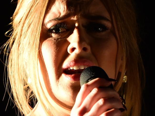 Adele performs onstage during the 58th Annual Grammy music Awards in Los Angeles February 15, 2016. AFP PHOTO/ ROBYN BECK