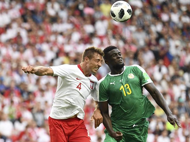 Poland’s defender Thiago Rangel Cionek (L) and Senegal’s midfielder Alfred N'Diaye (R) head the ball as they vie for it during the Russia 2018 World Cup. Picture: AFP