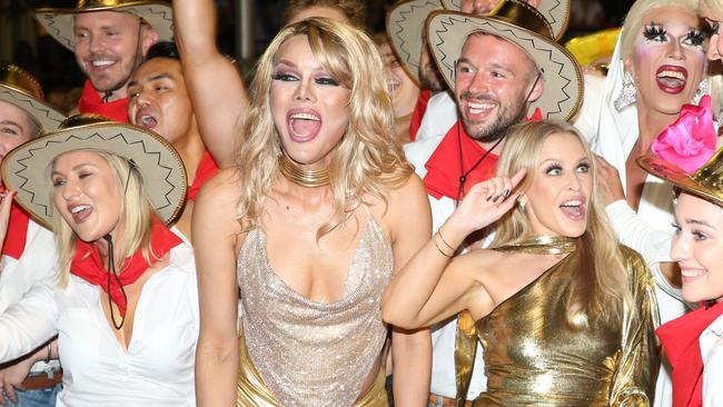 Kylie Minogue (right) with fans at the Sydney Gay and Lesbian Mardi Gras Parade in 2019. Picture: Damian Shaw